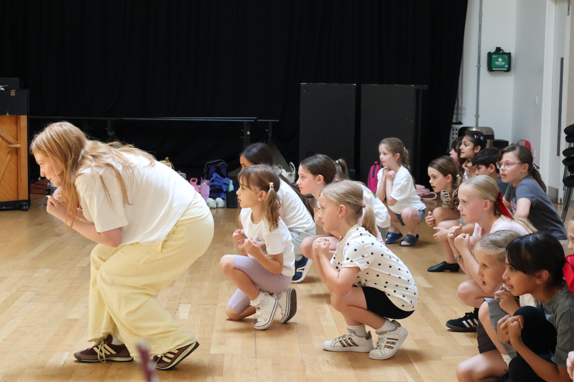 A ReAct tutor leading an expressive class exercise with primary-aged students